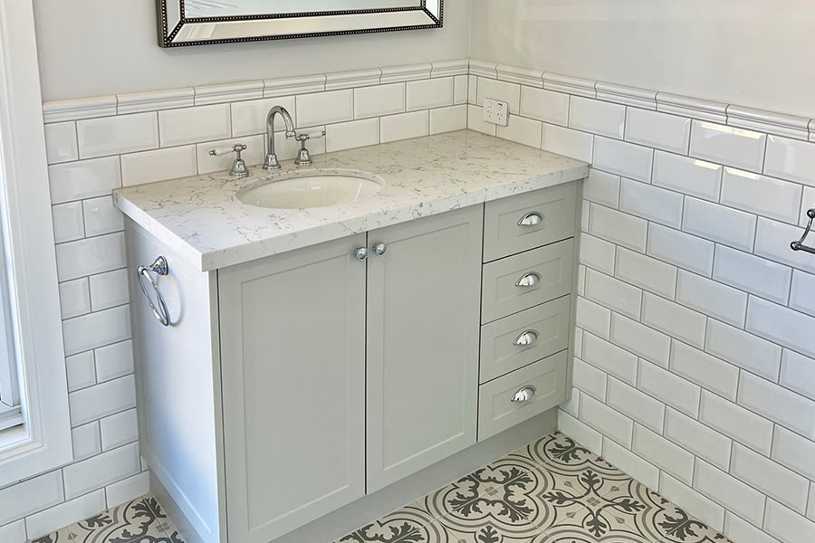 bathroom-vanity-with-patterned-tiles